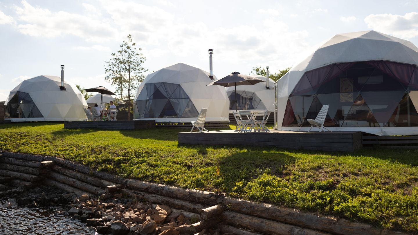 Geodesic dome with powder-coated steel frame standing in open landscape